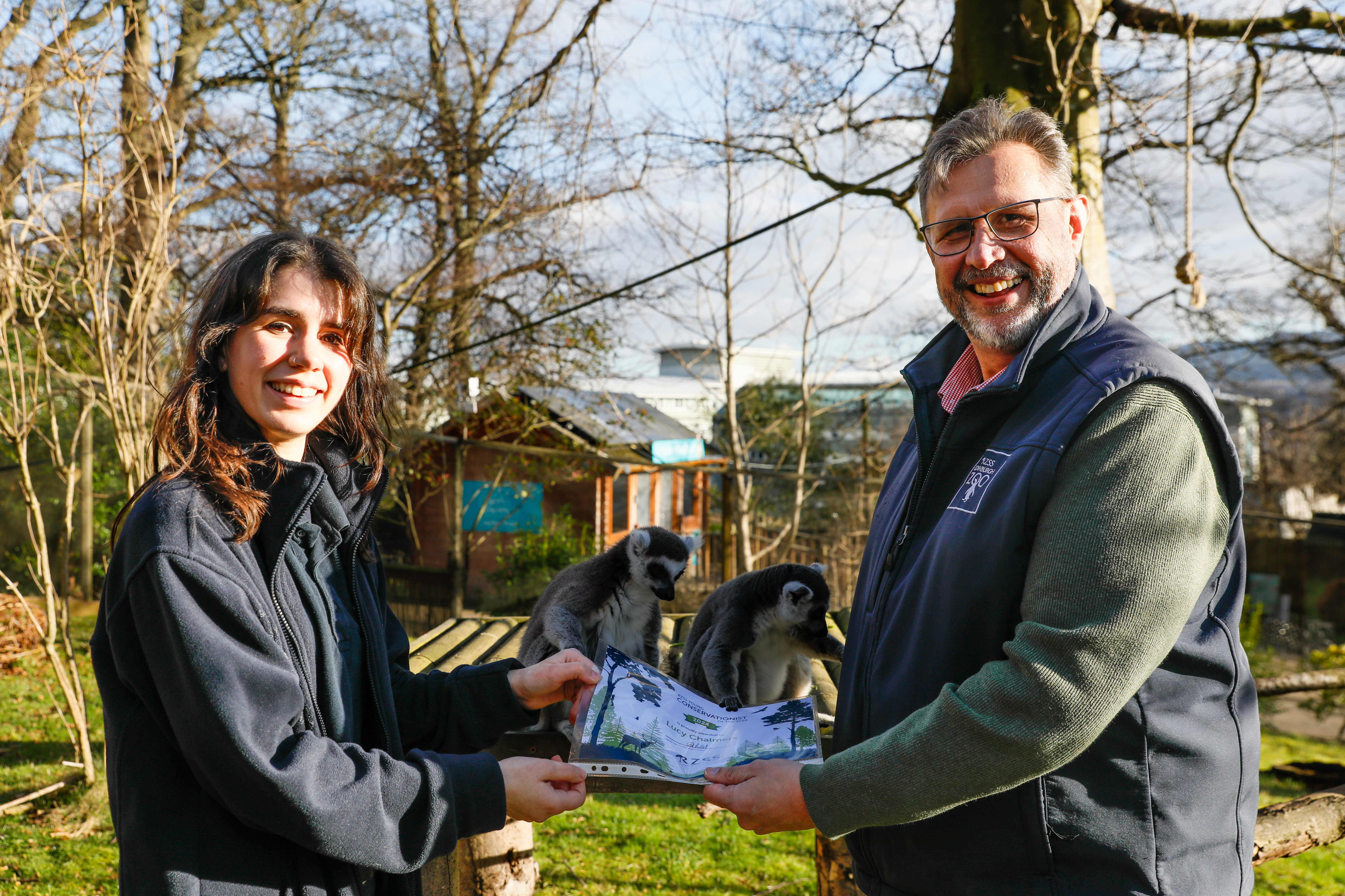 Lucy Chalmers receiving Young Conservationist of the Year 2024 from RZSS CEO David Field CREDIT: RZSS